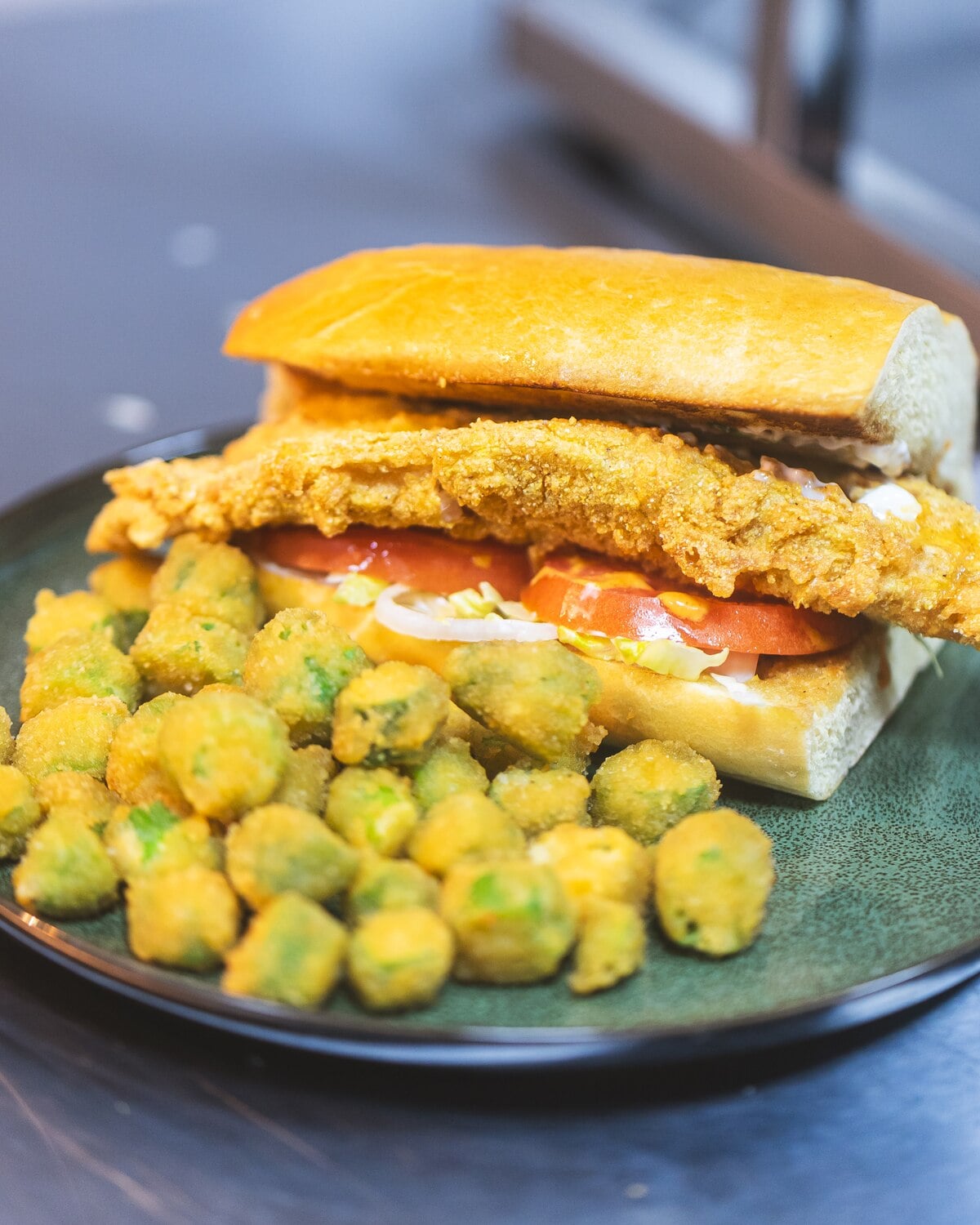 Crispy fried fish sandwich with fried okra, cooked with soul
